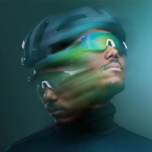 Cyclist wearing the Bollé Speedchaser glasses, featuring Volt+ lens technology for enhanced vision, and an eco-designed React for Good helmet. Spring/Summer 2025 Collection.