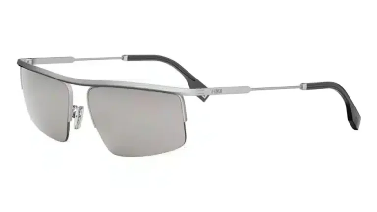 FENDI TRAVEL FE40141U sunglasses with a silver-tone metal frame and semi-rimless design. A sophisticated construction featuring a distinctive metallic bar, perfect for a bold urban style.