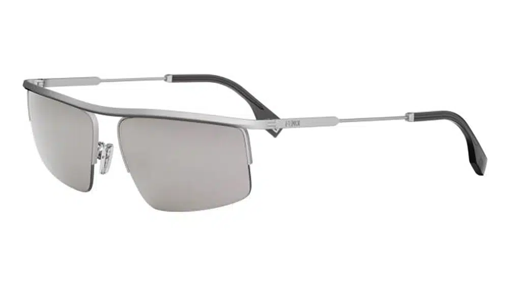 Lunettes de soleil FENDI TRAVEL FE40141U avec monture en métal argenté et design semi-cerclé. Conception sophistiquée avec barre métallique distinctive, idéale pour un style urbain audacieux.