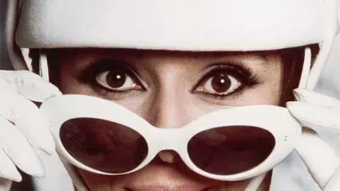 celebrity glasses : Audrey Hepburn wearing Oliver Goldsmith sunglasses, the iconic vintage model of the 1960s