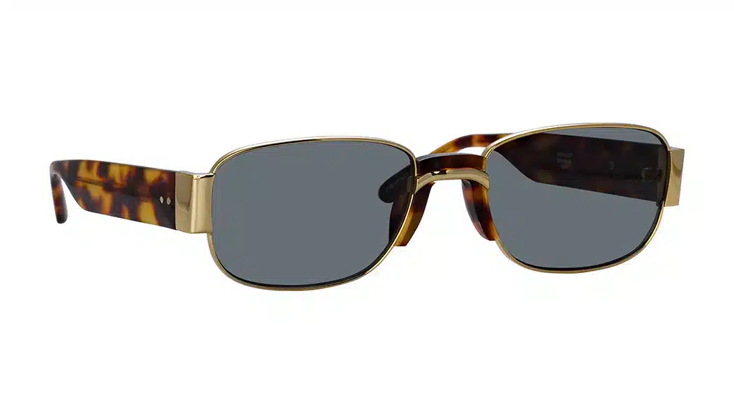 The Linda Farrow x Dries Van Noten DVN 196 sunglasses feature a gold-plated frame, tortoiseshell acetate temples, and grey lenses.