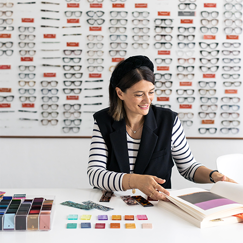 Elena Orsi Mazzucchelli, Product Development Manager at Mazzucchelli, analyzing cellulose acetate samples for sustainable innovation in the optical industry.