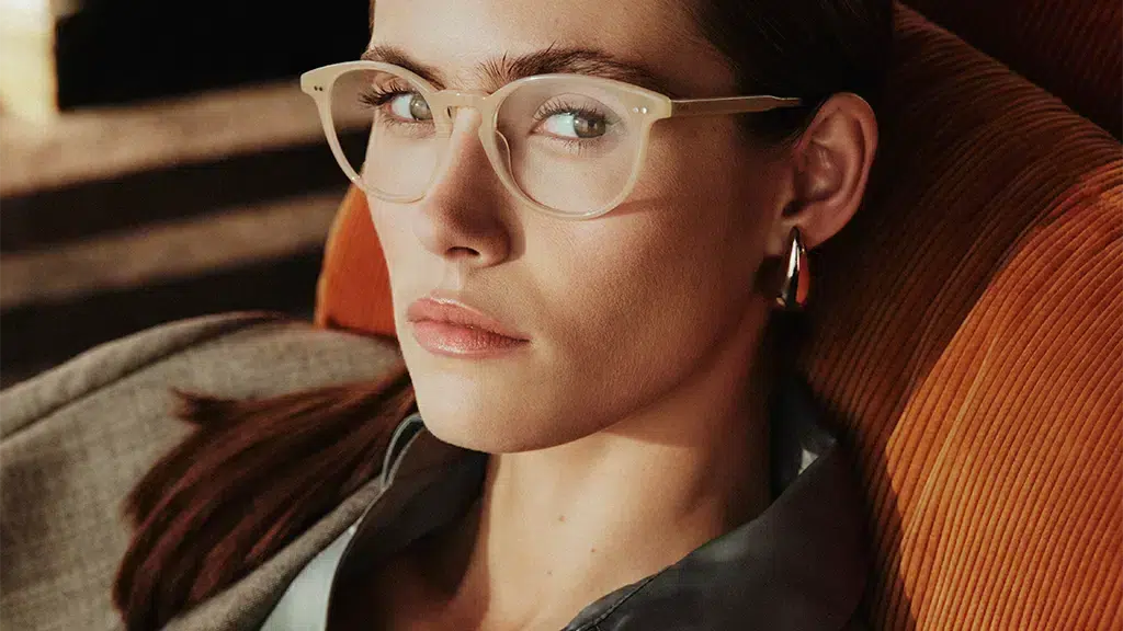 A woman wearing Etnia Barcelona Vintage 2025 eyeglasses, a refined transparent frame with a retro design.