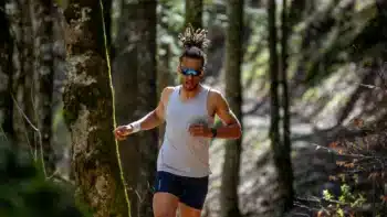 Julbo SUN 25. Man wearing Julbo SUN 25 sunglasses standing on a mountain peak at sunset. Man wearing Julbo SUN 25 sunglasses standing on a mountain peak at sunset. Man wearing Julbo SUN 25 sunglasses standing on a mountain peak at sunset.